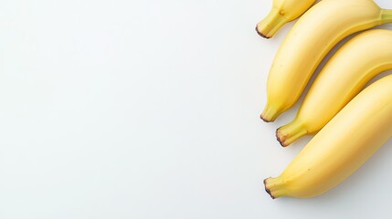 Fototapete - Clean banana background with plenty of white space, ideal for adding personalized messages or branding.