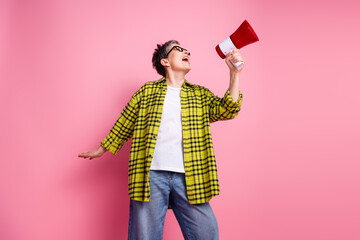 Sticker - Photo of nice aged woman loudspeaker checkered shirt isolated on pink color background