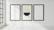 © JP STUDIO LAB - A minimalist poster series mock-up with three posters lined up on a plain wall, each with a simple design
