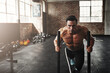 © peopleimages.com - Man, sled and exercise in gym for health, workout and muscle growth, agility and power with energy. Body builder, weights and training in sports club for fitness, strength and speed with resilience