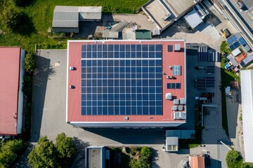 Poster - Solar panels on warehouse roofs. Green energy concept and electricity savings.