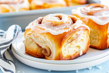 Cinnamon roll dessert with icing and baked goods on a plate for a delicious treat