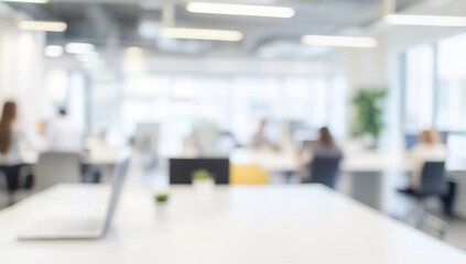 Blurred office interior with people working in the blurred background