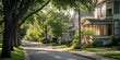 © Jardel Bassi - Treelined Street with Beautifully Restored Victorian Home