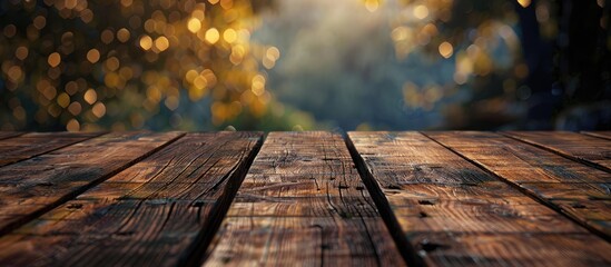 Poster - Wooden tabletop in front of an abstract blurred backdrop Unoccupied wooden table area for text marketing promotion Blank wood table copyspace for background