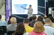 © Anton Gvozdikov - Speaker presenting information to an attentive audience at a business conference, focused on engaging and informative session.