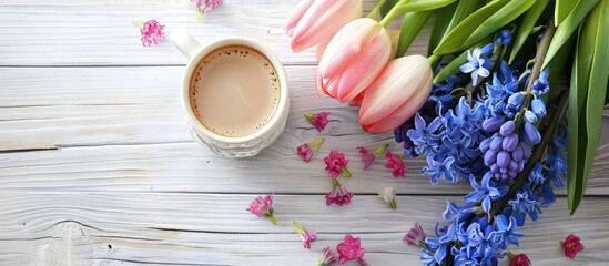 Wall Mural - Pink tulips and blue hyacinth flowers alongside a cup of coffee for Valentine s Day on a white wooden table with copyspace