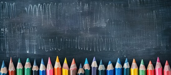Poster - colored pencils and a blackboard with copy space
