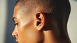 © pinporn manosri - A close-up of a buzz cut, highlighting the simplicity and low-maintenance appeal of this short hairstyle
