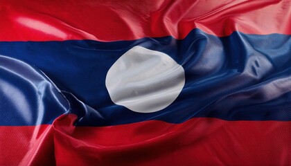 Close up of a waving Laos flag. The red, blue, and white colors are vibrant and the fabric is textured.