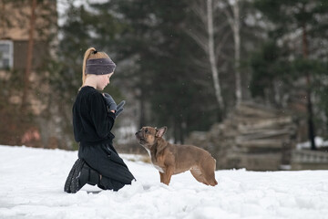 Wall Mural - Portrait of a beautiful ten year old girl with a dog.