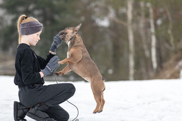 Wall Mural - Portrait of a beautiful ten year old girl with a dog.