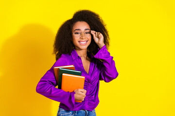 Poster - Photo portrait of pretty young girl hold books reader wear trendy violet outfit isolated on yellow color background