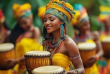 Portrait of a beautiful young african woman in traditional clothing playing drums. Heritage day