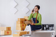 © David - Startup SME small business entrepreneur SME or freelance Asian woman calling phone, online marketing packaging box and delivery, SME concept
