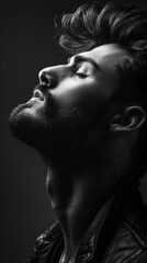 Poster - A man with a beard and a black jacket is looking at the camera