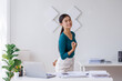 © David - Happy beautiful young Asian freelance business woman standing in workplace office