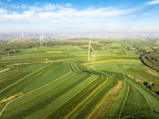 view of wind power turbine in field