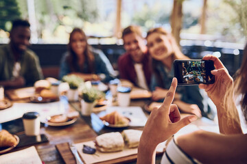 Aufkleber - Phone, friends and picture with lunch at restaurant for reunion memory, social media post and profile update. Group, people and hand with smartphone screen at cafe for dinner event, happy and relax