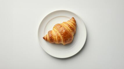 top view scene of a croissant on a plate on white background