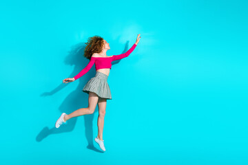 Canvas Print - Full size photo of pretty young girl jump empty space ad wear top isolated on teal color background