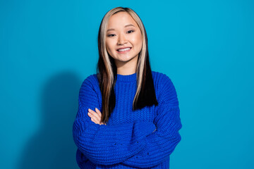 Wall Mural - Portrait photo of dyed hair young vietnamese girl folded hands satisfied smiling seems confident isolated on blue color background