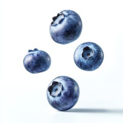 Wall Mural - Blueberries Falling on White Background.