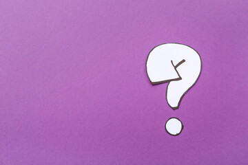 Paper quiz card with question mark on purple background