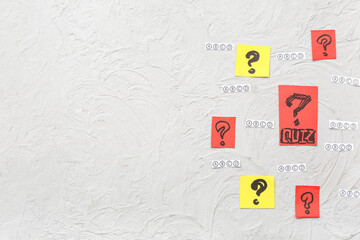 Quiz form and cards with question marks on grunge white background