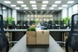 © Yuliia - Close-up shot of a single employee's empty desk with a box of personal belongings packed away, symbolizing job loss and the effects of business downsizing.