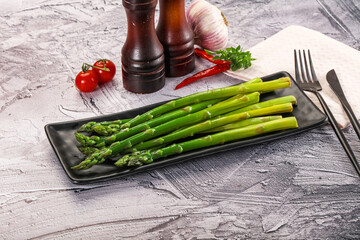 Wall Mural - Vegan cuisine - Boiled asparagus with oil