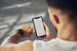 © Van Wyk/peopleimages.com - Man, fitness and checking with phone screen or smartwatch for tracking, performance or progress at gym. Male person with wristwatch and smartphone for training app, sync or health tracker on mockup