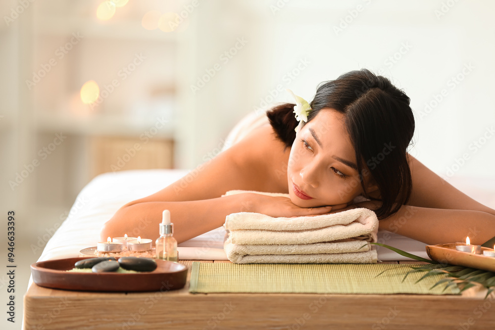 Pretty young Asian woman in spa salon