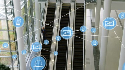 Wall Mural - Digital communication icons animation over people on escalators in modern building