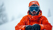 © fotogurme - Snowboarder wiping snow off foggy goggles while sitting frustrated on a slope surrounded by soft untouched snow bright gear contrasting against the white background
