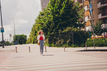 Canvas Print - Full size photo of excited dreamy lady walking cross road wear white shirt walking outside modern urban city street