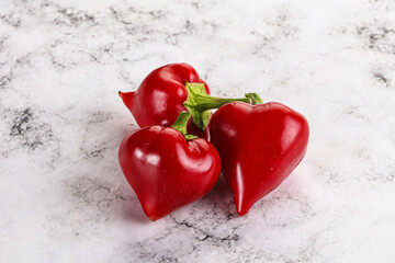 Wall Mural - Red spicy cherry pepper heap