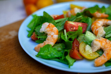 Salad with shrimp with cherry, lemon and vegetables. Healthy food. Homemade simple recipe