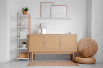 Wall Mural - Wooden chest of drawers and shelving unit with houseplants near white wall in interior of living room