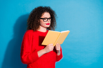 Poster - Photo portrait of pretty young girl read book skeptical wear trendy red outfit isolated on blue color background