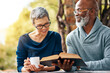 © SensSai/peopleimages.com - Senior, nature or happy couple with coffee or bible in spiritual religion for peace, guidance or learning. Book, interracial marriage and people in park for scripture, worship or prayer for faith