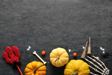 Wall Mural - Composition with pumpkins and decorations for Halloween on dark background