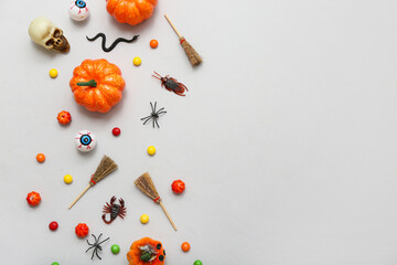 Wall Mural - Composition with different decorations and candies for Halloween on grey background