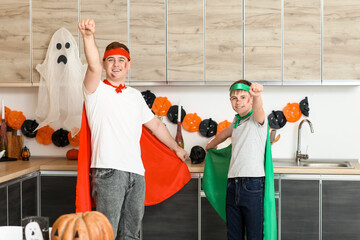 Poster - Father with his son dressed for Halloween as superheroes in kitchen