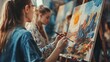 © Youttakone - A group of people participating in a painting workshop, each working on their own canvas with different artistic styles and techniques