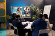 © DC Studio - Project team attending a videocall meeting with associates, creating a presentation to give insight on project plans. Employees and stakeholders discuss on remote videoconference.