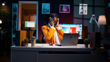 African american student communicating with professors and classmates on online class videocall, using academic web connection platforms. Girl participating in webinar college lesson. Camera B.