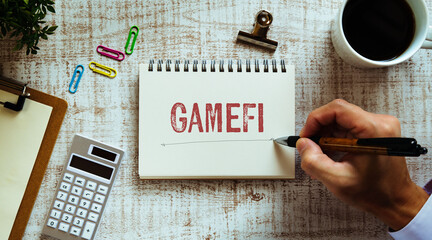 Poster - There is notebook with the word GameFi. It is as an eye-catching image.