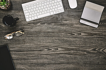 Poster - Table, tech and workstation with keyboard, flat lay and high angle of equipment, creative and tea. Office, wood and notebook for planning in business, above and glasses on desk, coffee and plant