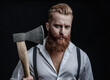 © be free - Brutal man in suspenders with ax isolated on black. Mature redhead man with hairstyle. Brutal male fashion style. Male brutality. Vintage brutality guy with axe in retro suspenders